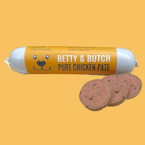 Roll of Betty & Butch Pure Chicken Pate with slices on a yellow background