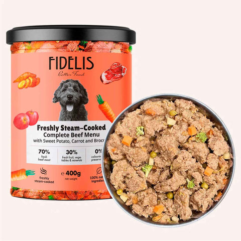 Fidelis Freshly Steam-Cooked Beef Dog Food 400g tub beside a bowl of chunky beef with sweet potato, carrot and broccoli