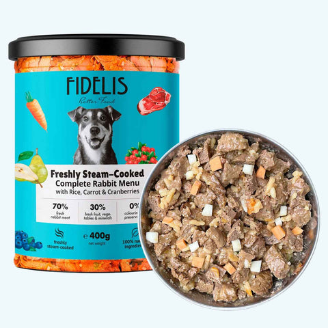 Fidelis Freshly Steam-Cooked Rabbit Dog Food with brown rice, carrot and cranberries, shown with a bowl of chunky fresh food.