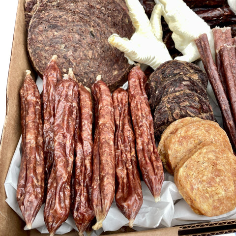 Aerial view of hairy rabbit ears, puffed chicken feet, and natural chews from the Butcher’s Banquet.