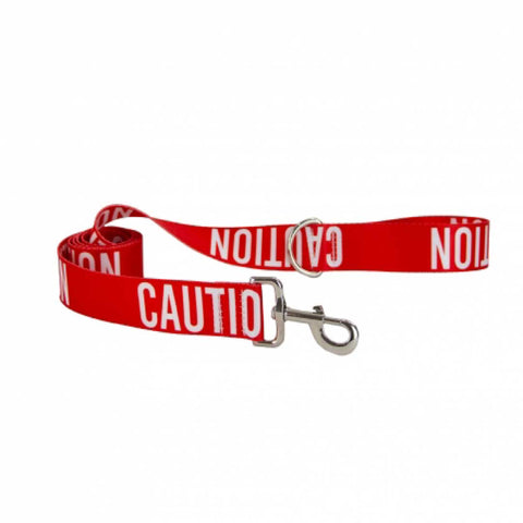 Red dog leash with 'CAUTION' text on a white background