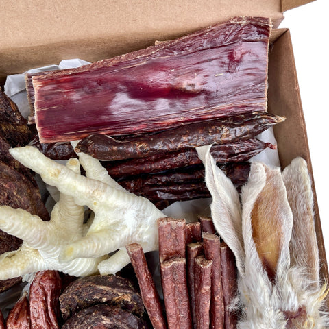 Aerial view of natural chicken, pork, and tripe sausages with meat sticks included in the Butcher’s Banquet.