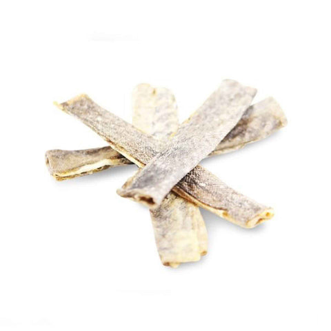 fish jerky dog treats on a white background