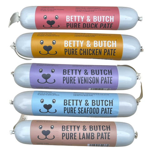 Five packages of Betty & Butch pet food with different flavors on a white background